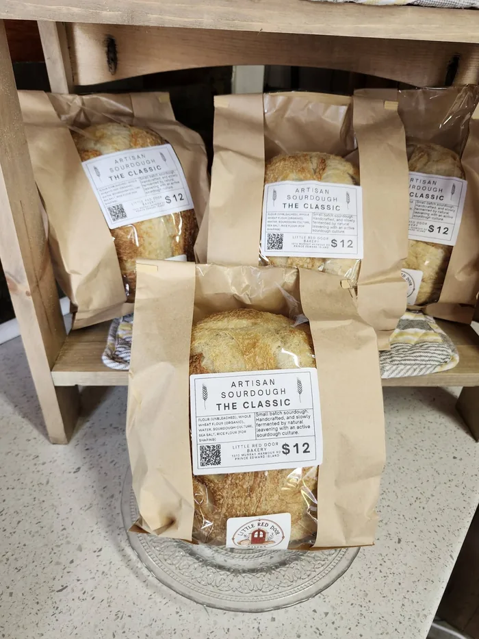 Bagged sourdough loaves on the farm store shelf, priced