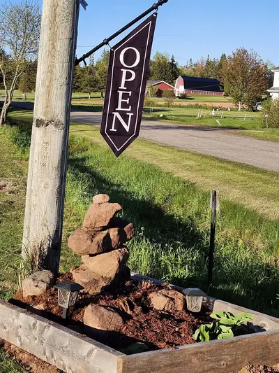 The roadside OPEN flag at the end of the driveway on Abney Road