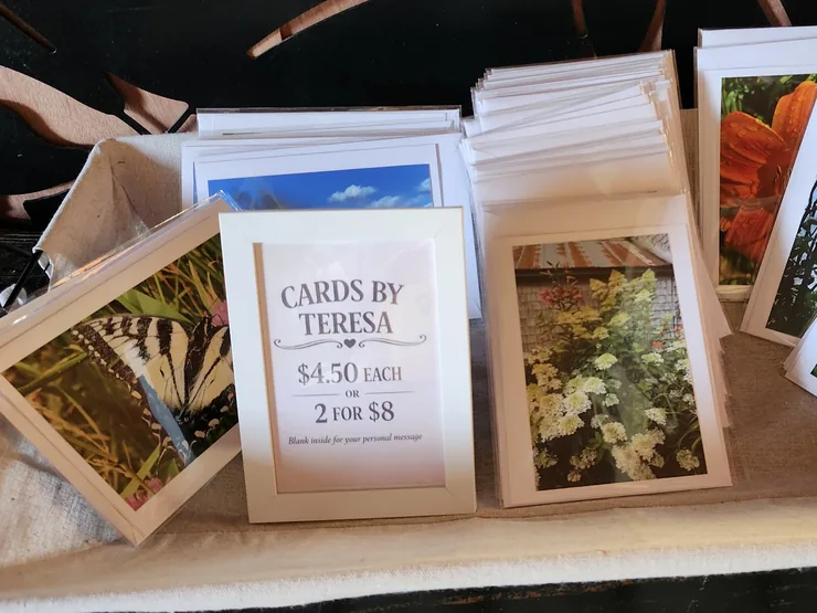 Cards by Teresa, blank inside, displayed in a basket in the store