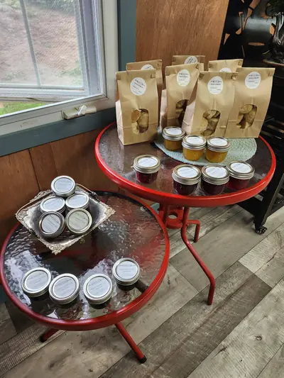 Jars and packaged treats arranged on a red side table